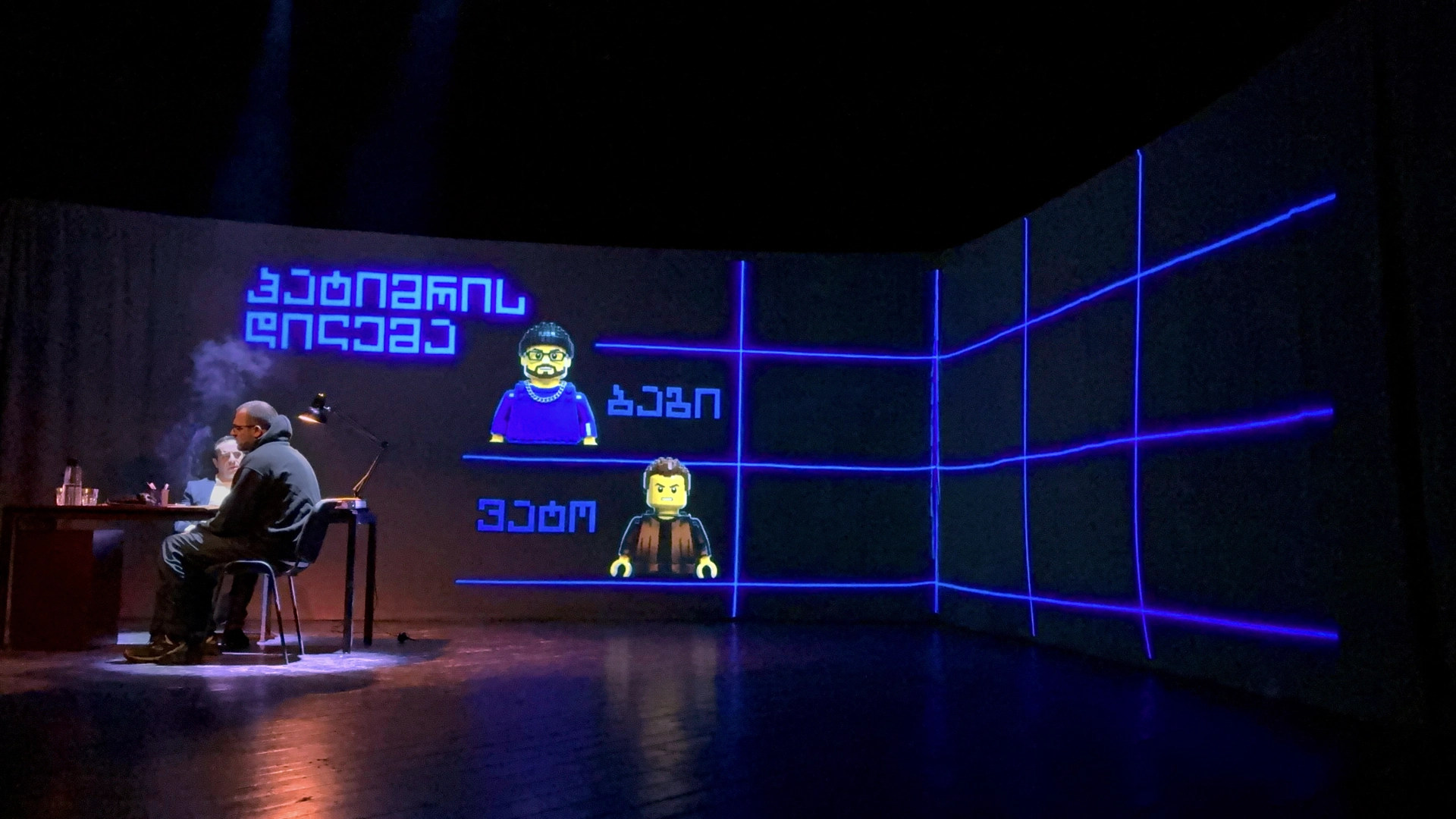 Actor Giorgi Makharadze as Bagi talking about Game Theory, a scene from the play at City Theatre