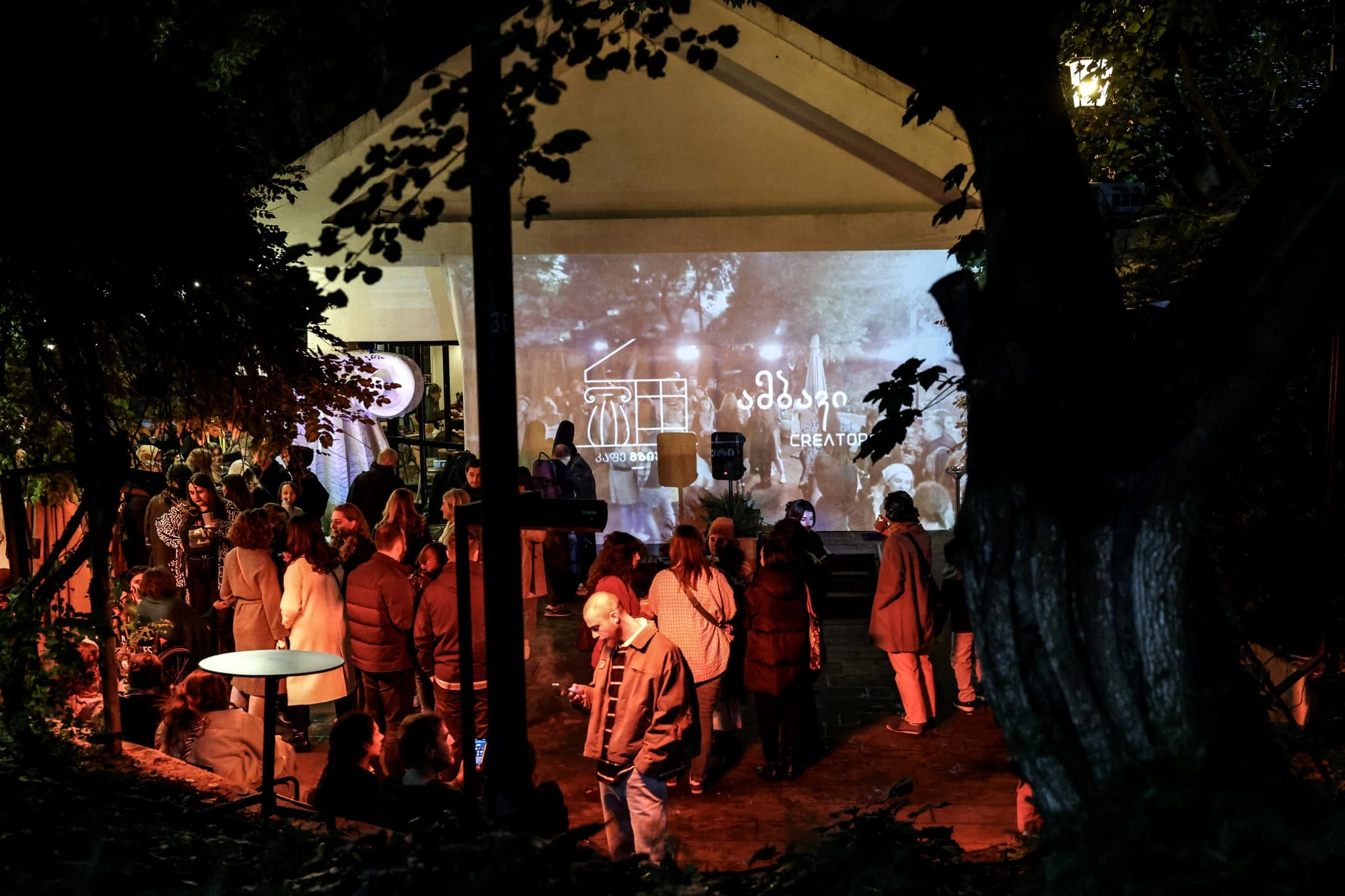 The facade of Cafe Mziuri brought to life through projection by Ambavi Creators