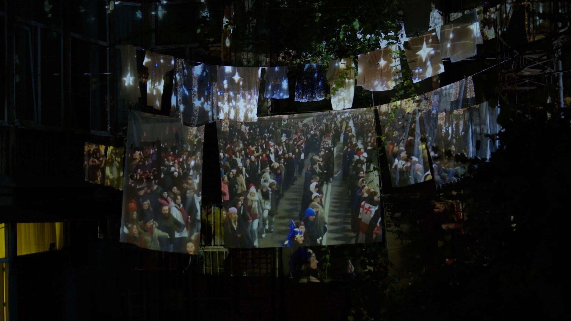 Digital projection on courtyard laundry for Georgia's Guardian Women artistic installation